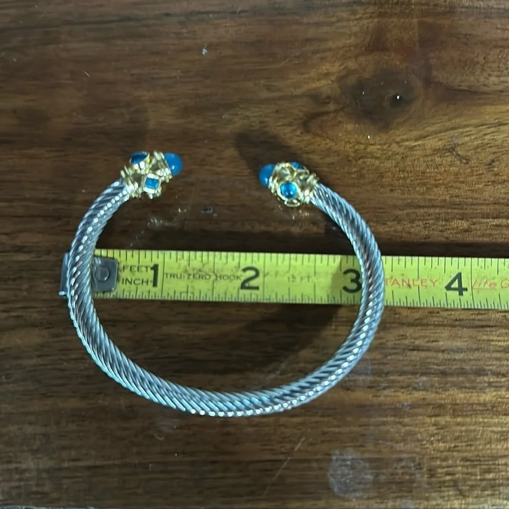 - Sophisticated Silver and Gold Bracelet with Blue Gemstones